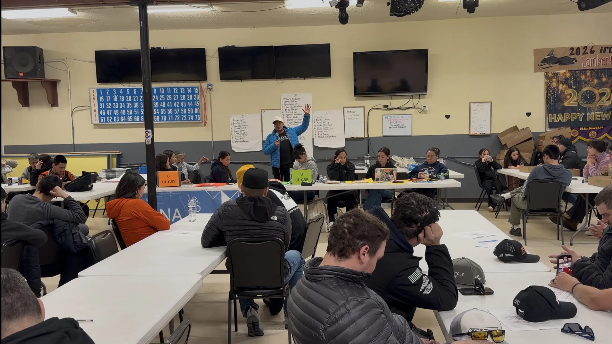 Minister Tommy Frankson conducting a community bible study and craft workshop at Monson Hall in Kotzebue, Alaska with local residents.